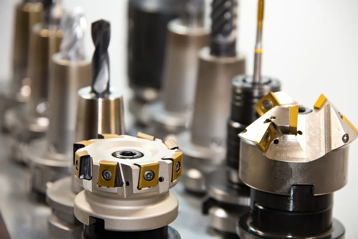 Industrial tooling and machined cutting heads arranged for production use