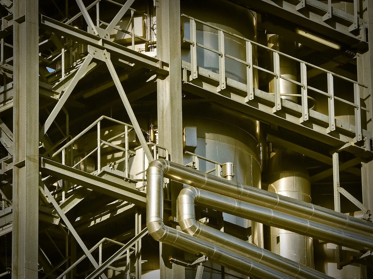 Industrial plant structure with steel piping and platforms