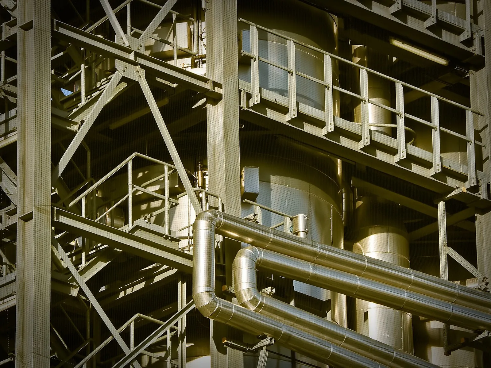 Industrial plant structure with steel piping, platforms and process equipment